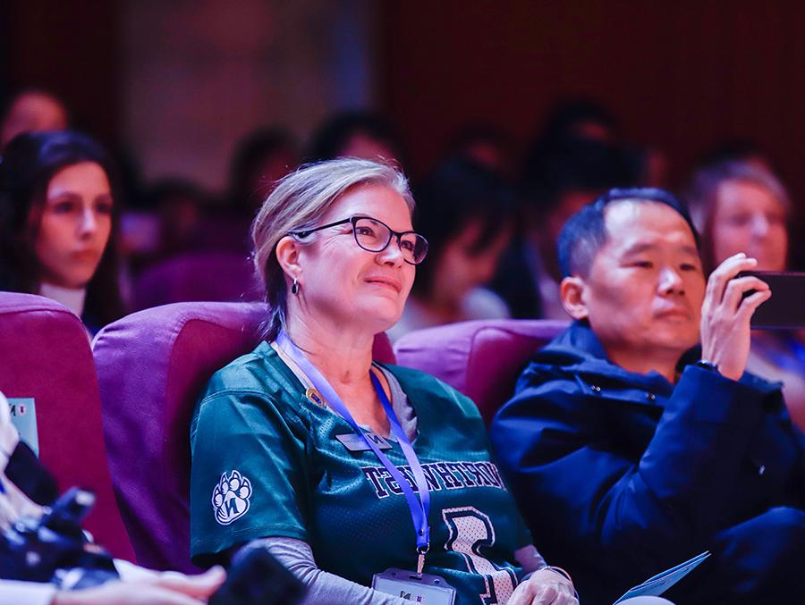 Dr. Nissa Ingraham takes in a presentation during the Northwest group's visit to Hebei Normal University in China. (Photo courtesy of Dr. Shelby Lee/GCBEI)